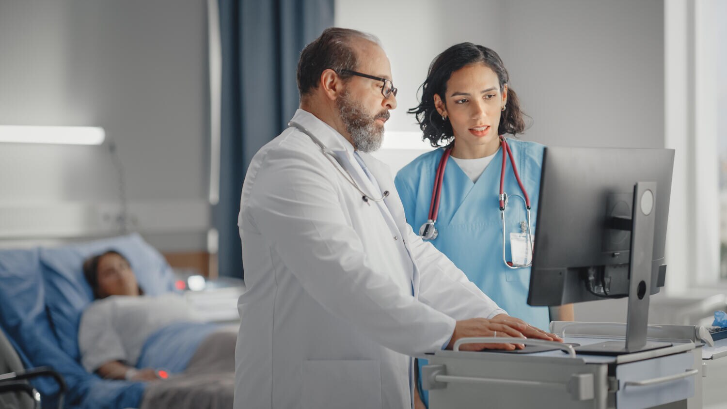 Doctor talks with nurse in hospital