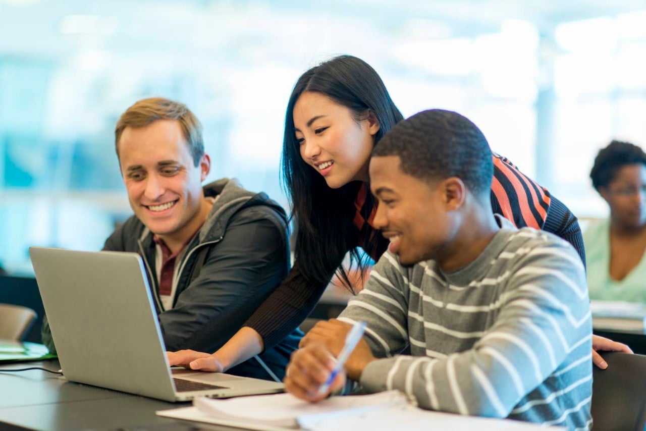 Students working together on laptop