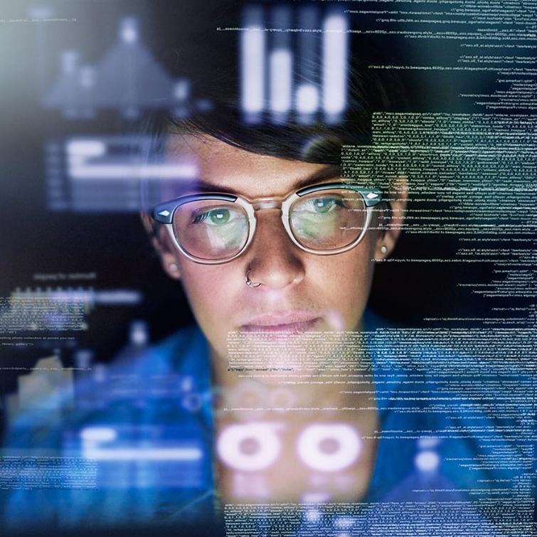 Young female programmer looking through code