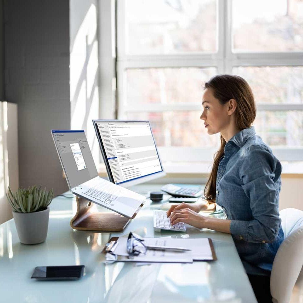 Woman working on laptop at desk