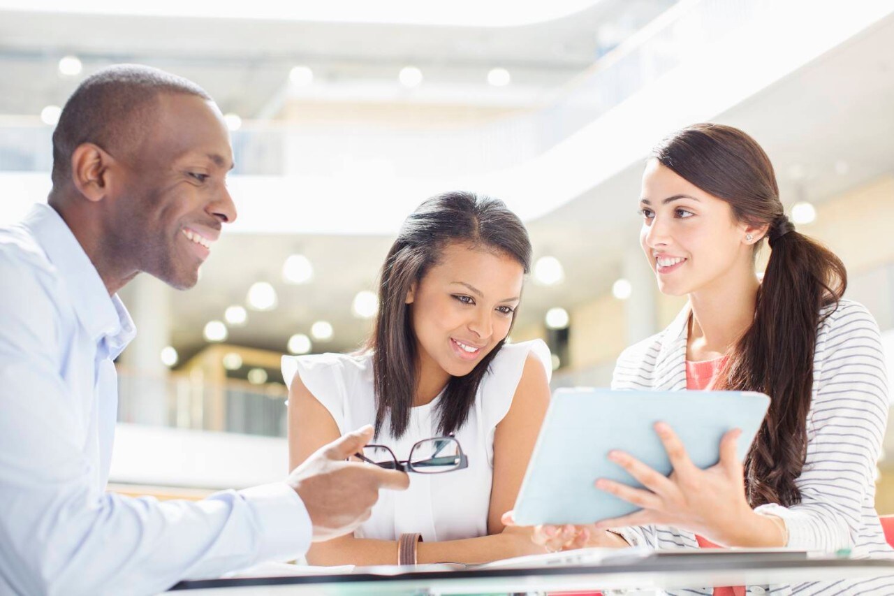 Business People Meeting with a Tablet Business People Meeting with a Tablet